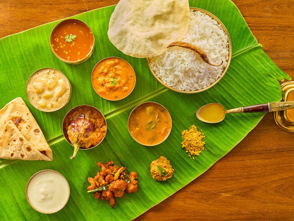 Andhra veg meals laid out across a banana leaf